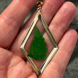 Gold Diamond-Shaped Pendant with Green Leaf